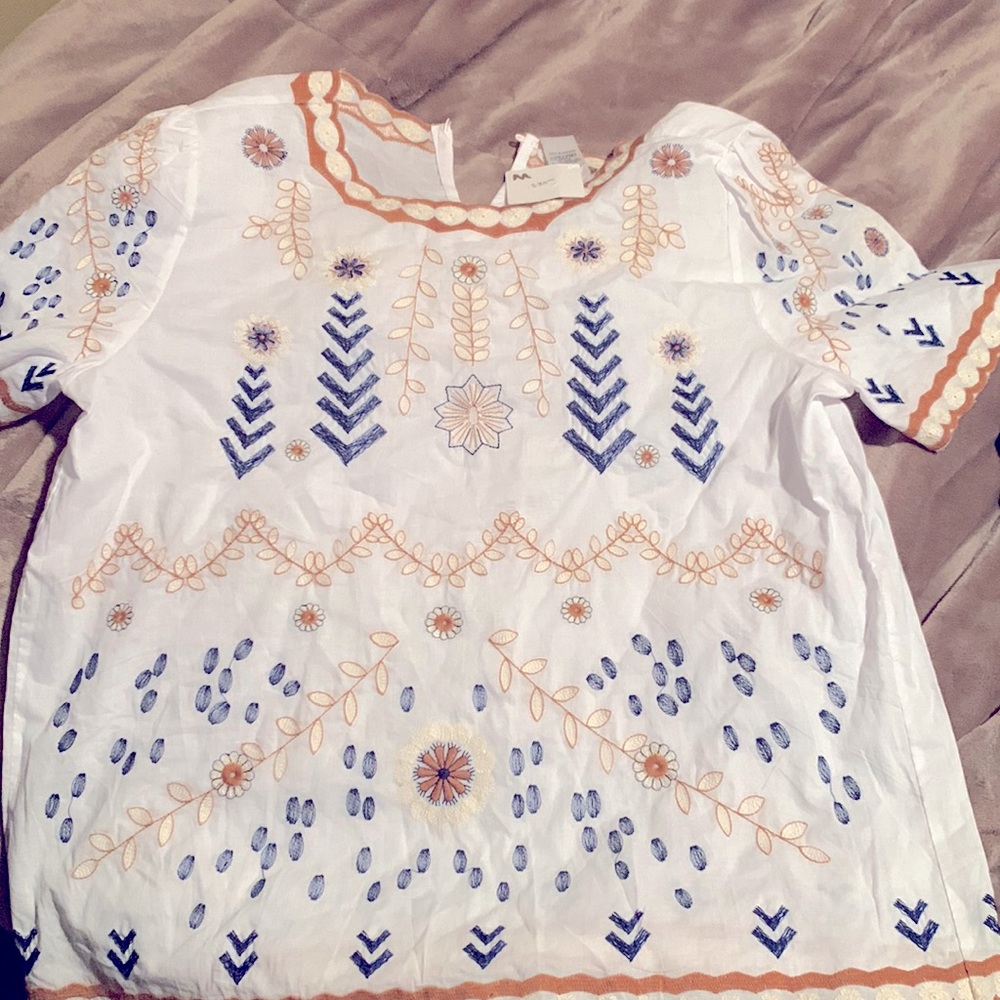 White cotton blouse with gold trim/navy/ivory  designs along chest and waist NWT